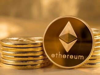 Picture of ethereum coins staked together with one coin stood next to them